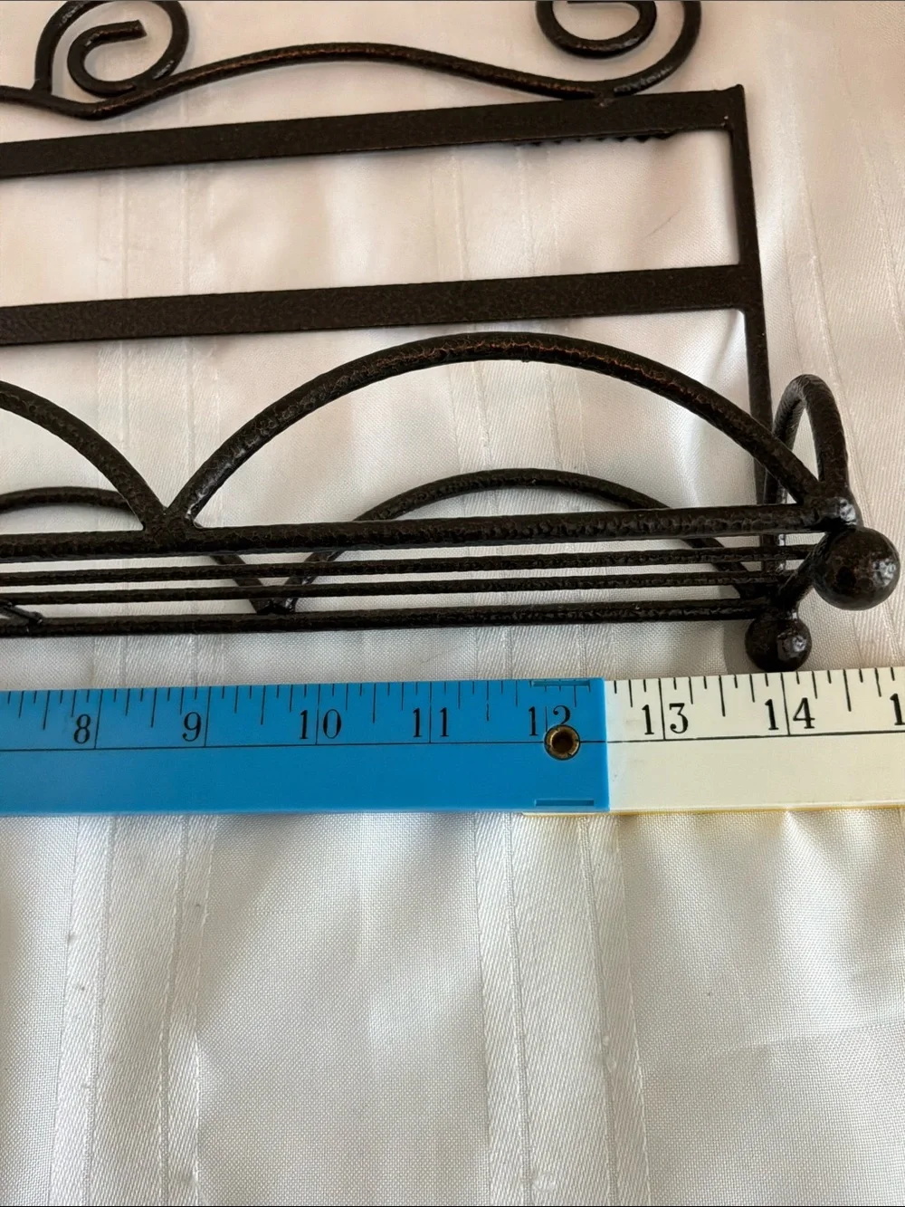 Decorative Brown Metal Wall Rack with Scroll Design